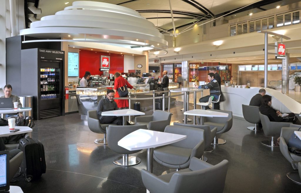 People sitting and ordering at illy Caffe and Coffee Bar Project in Detroit Metro Airport McNamara Terminal collaboration with Studio H2G Interior Architecture
